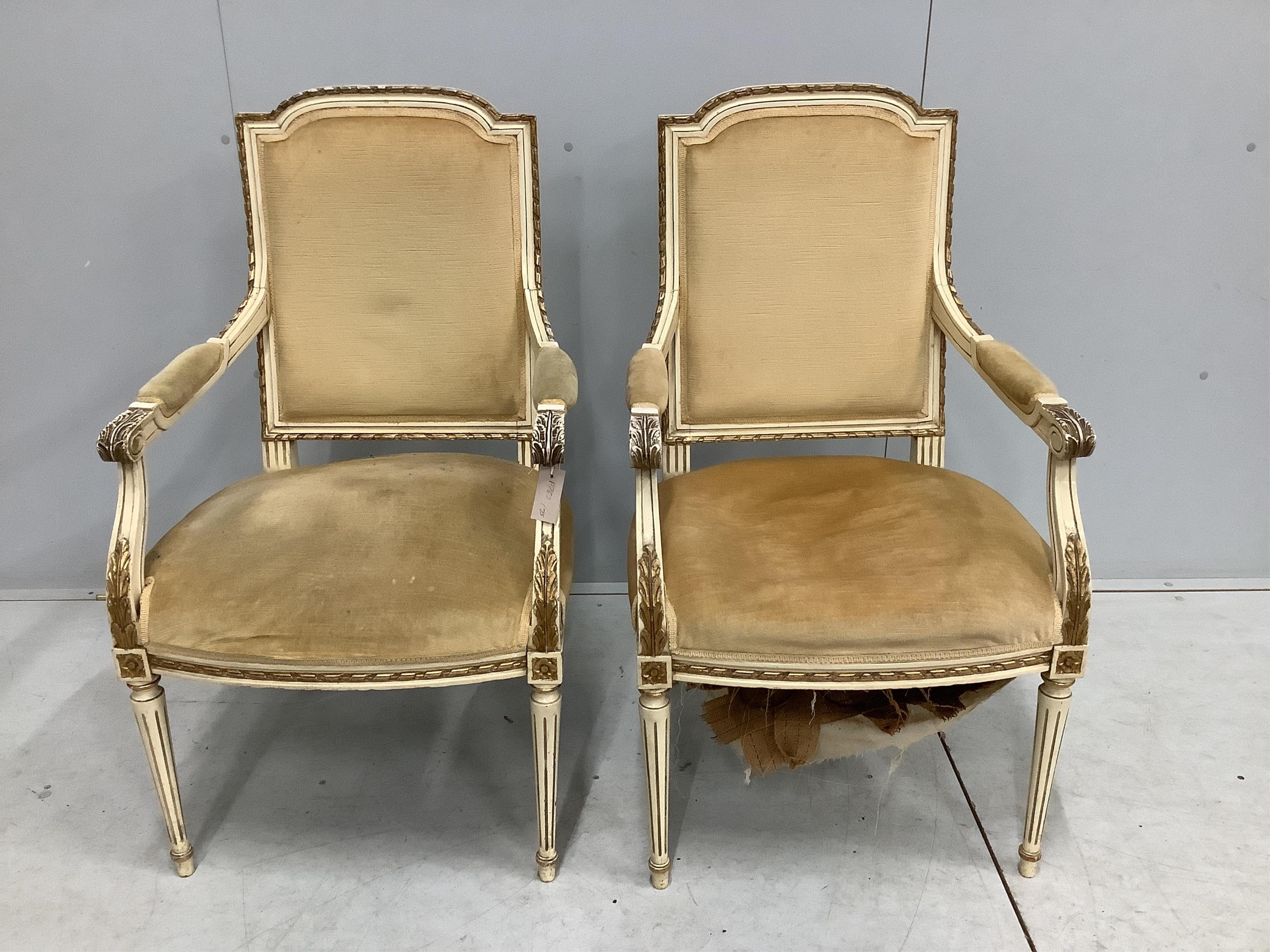 A set of six Louis XVI style cream and parcel gilt carved wood dining chairs, two with arms. Condition - fair